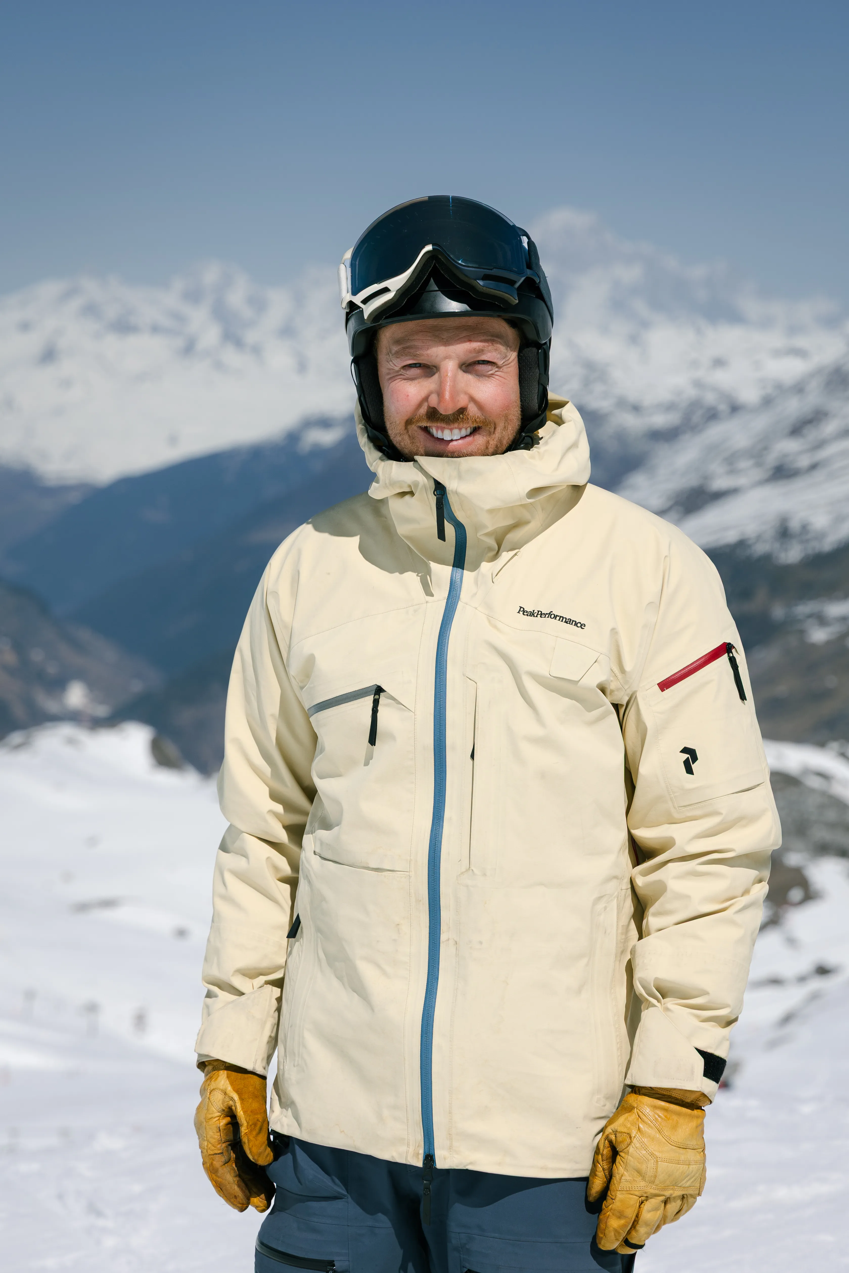 Picture of ski instructor Dave Hudson standing in front of a mountain backdrop in Val d'Isere, France