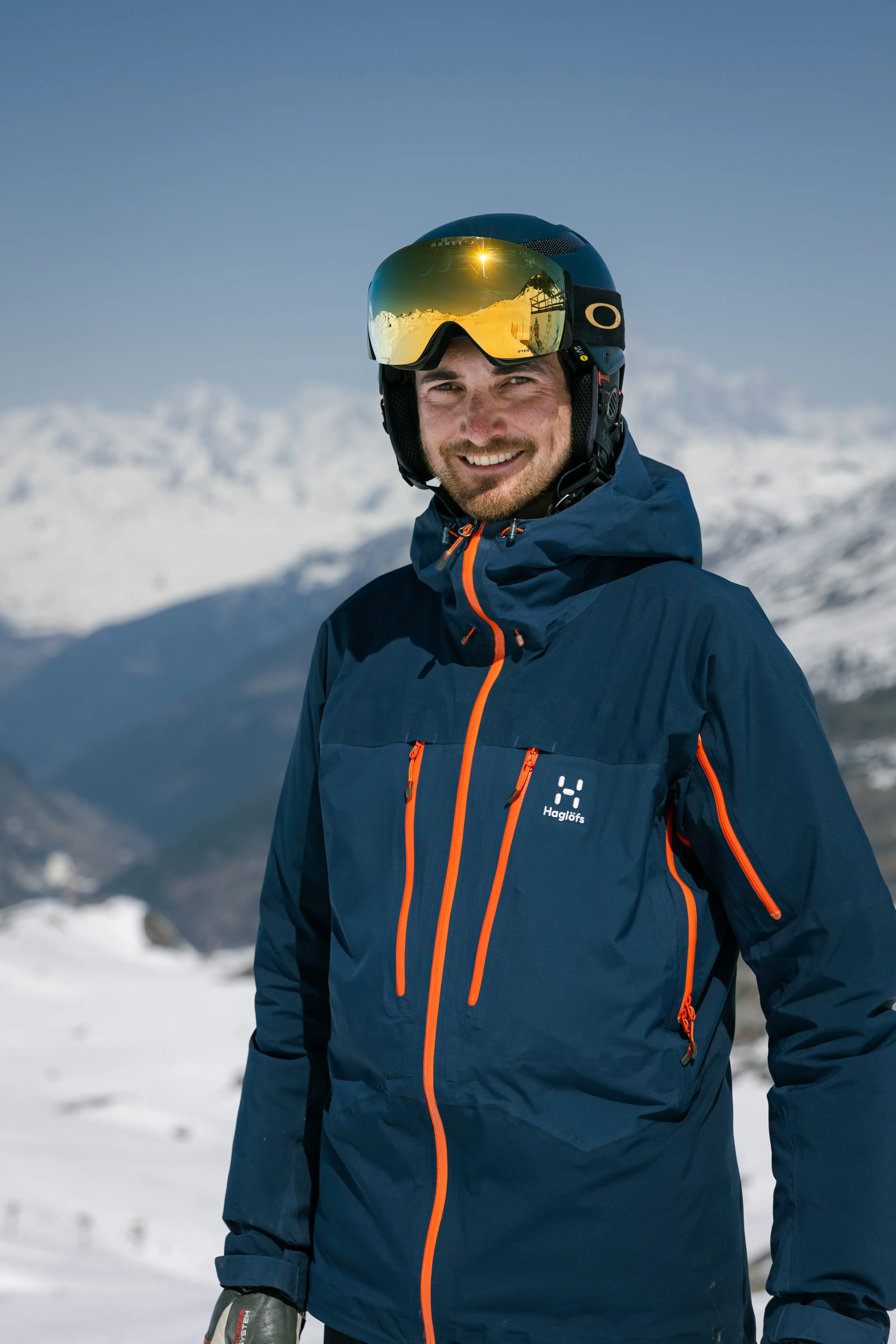Picture of ski instructor Dave Walker standing in front of a mountain backdrop in Val d'Isere, France